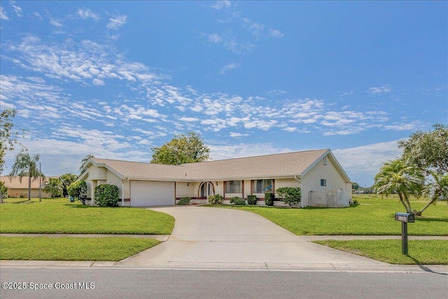 1181 Fairway Ct NE, Palm Bay, FL 32905 - single story home with an attached garage, concrete driveway, a front yard, and stucco siding