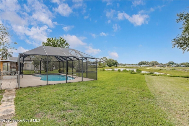 1181 Fairway Ct NE, Palm Bay, FL 32905 - outdoor pool featuring a water view, a yard, a patio, and glass enclosure