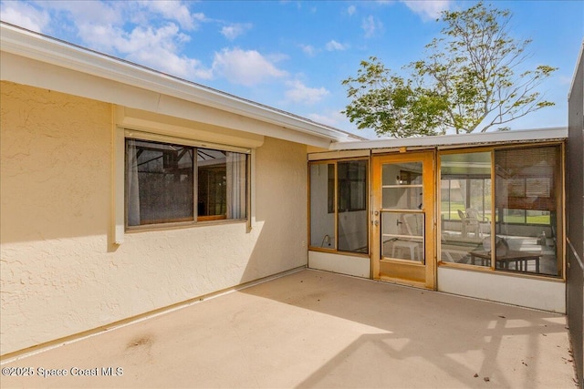 1181 Fairway Ct NE, Palm Bay, FL 32905 - view of patio with a sunroom
