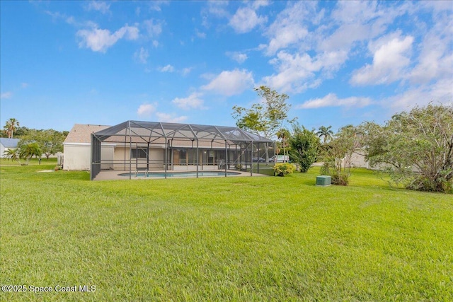 1181 Fairway Ct NE, Palm Bay, FL 32905 - view of green lawn featuring an outdoor pool and glass enclosure