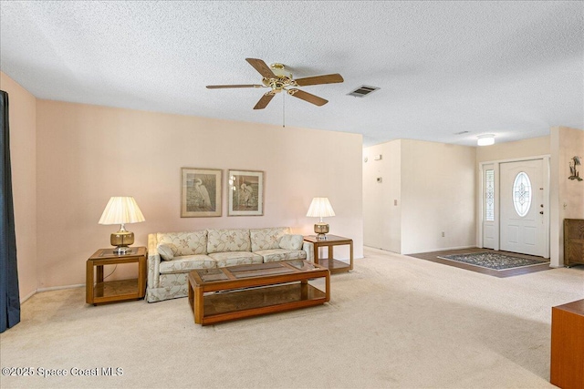 1181 Fairway Ct NE, Palm Bay, FL 32905 - carpeted living area with a ceiling fan, a textured ceiling, and baseboards