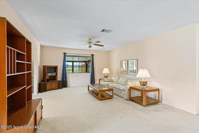 1181 Fairway Ct NE, Palm Bay, FL 32905 - living area featuring carpet, a textured ceiling, and ceiling fan