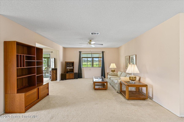1181 Fairway Ct NE, Palm Bay, FL 32905 - living room with carpet floors, a textured ceiling, ceiling fan, and baseboards