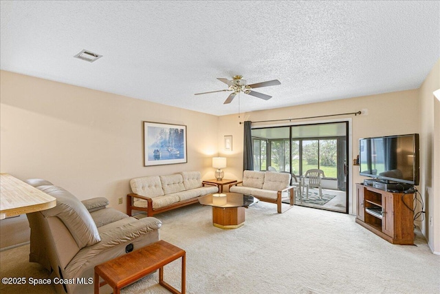 1181 Fairway Ct NE, Palm Bay, FL 32905 - carpeted living room with ceiling fan and a textured ceiling