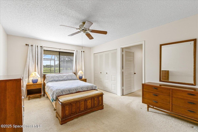 1181 Fairway Ct NE, Palm Bay, FL 32905 - bedroom featuring light carpet, a textured ceiling, a ceiling fan, and a closet