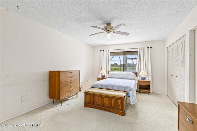 1181 Fairway Ct NE, Palm Bay, FL 32905 - bedroom featuring light colored carpet, a closet, a textured ceiling, a ceiling fan, and baseboards
