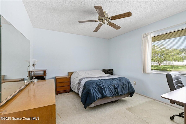 1181 Fairway Ct NE, Palm Bay, FL 32905 - carpeted bedroom with a textured ceiling and ceiling fan