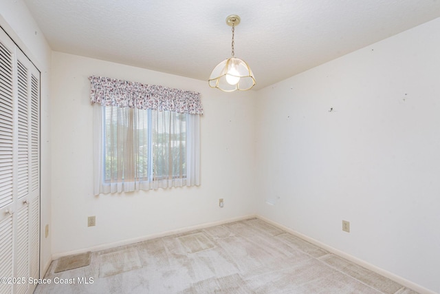 1080 Mayflower Ave, Melbourne, FL 32940 - unfurnished bedroom featuring a closet, carpet floors, and baseboards