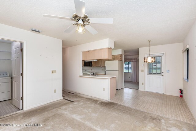 1080 Mayflower Ave, Melbourne, FL 32940 - kitchen featuring washer / clothes dryer, light colored carpet, freestanding refrigerator, ceiling fan, and a peninsula