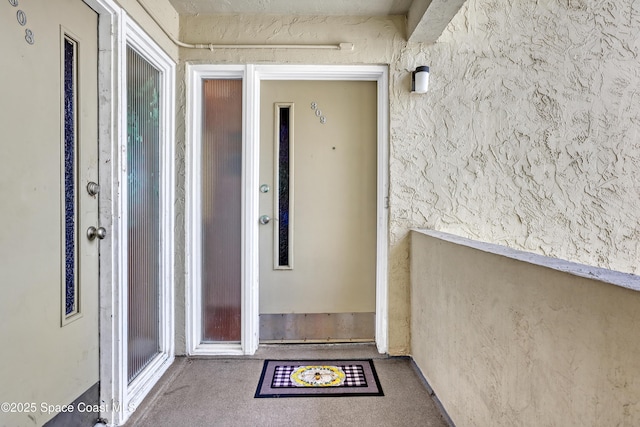 5050 Ocean Beach Blvd Unit 309, Cocoa Beach, FL 32931 - view of exterior entry featuring stucco siding