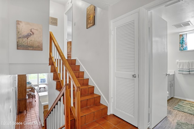 5050 Ocean Beach Blvd Unit 309, Cocoa Beach, FL 32931 - stairway featuring baseboards