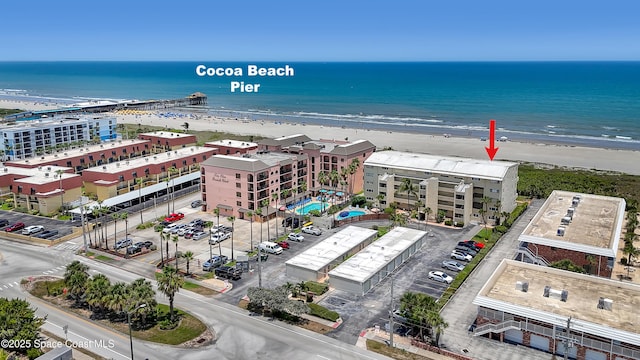 5050 Ocean Beach Blvd Unit 309, Cocoa Beach, FL 32931 - drone / aerial view of expansive coastline and apartment complex