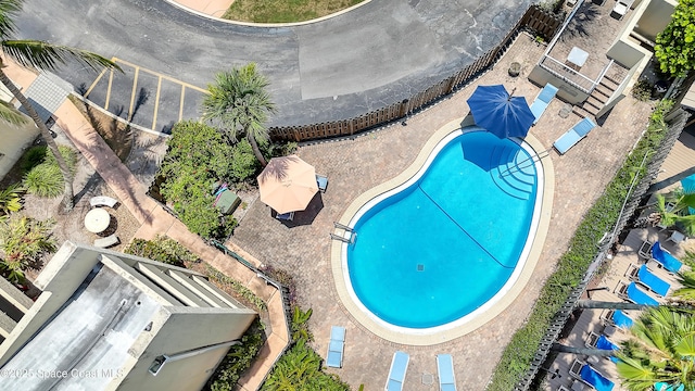 5050 Ocean Beach Blvd Unit 309, Cocoa Beach, FL 32931 - drone / aerial view of a pool area