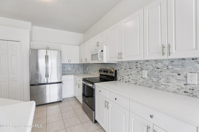 1609 Kestrel Ct, Rockledge, FL 32955 - kitchen featuring stainless steel appliances, light countertops, white cabinetry, tasteful backsplash, and a textured ceiling