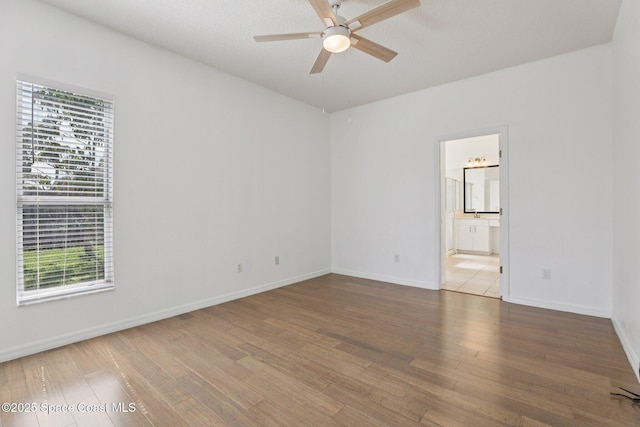 1609 Kestrel Ct, Rockledge, FL 32955 - unfurnished room featuring wood finished floors, a ceiling fan, and baseboards