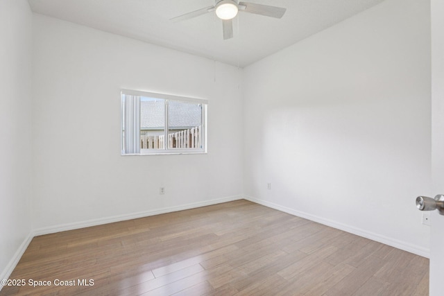 1609 Kestrel Ct, Rockledge, FL 32955 - spare room featuring wood finished floors, ceiling fan, and baseboards