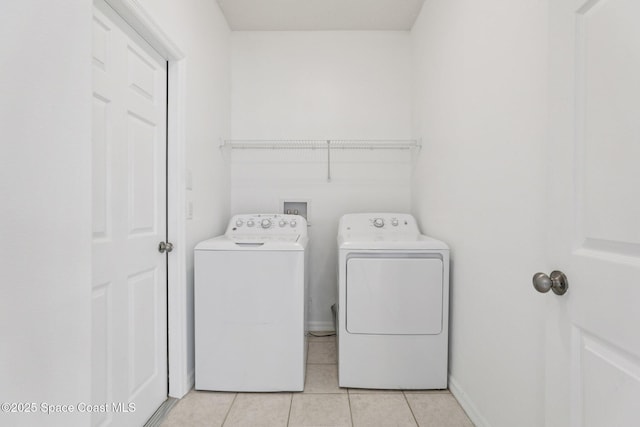 1609 Kestrel Ct, Rockledge, FL 32955 - laundry room with separate washer and dryer and light tile patterned floors