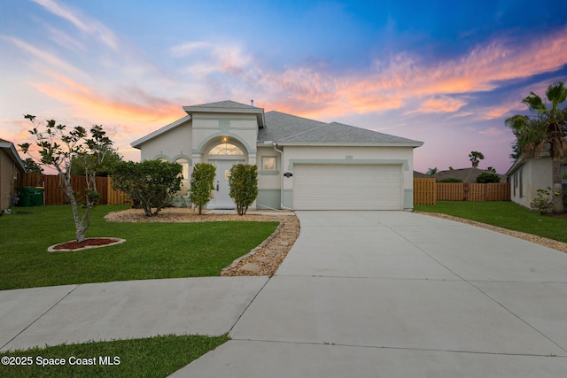 1609 Kestrel Ct, Rockledge, FL 32955 - view of front of home with an attached garage, stucco siding, concrete driveway, and roof with shingles