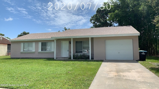 1241 Cambo Ct NE, Palm Bay, FL 32905 - single story home featuring a front lawn, stucco siding, covered porch, and a garage
