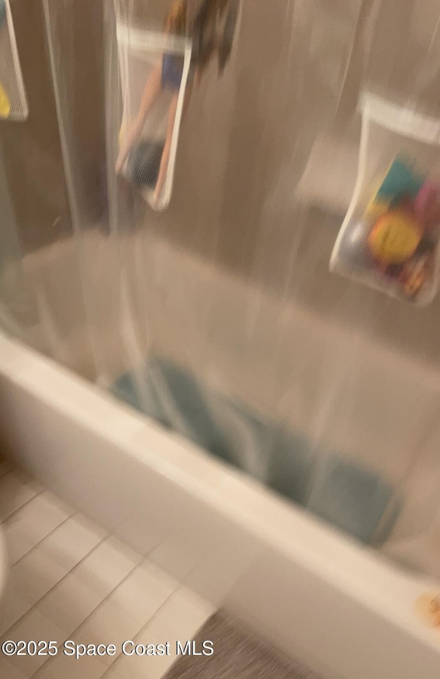 1241 Cambo Ct NE, Palm Bay, FL 32905 - bathroom view of shower / bathtub combination with curtain