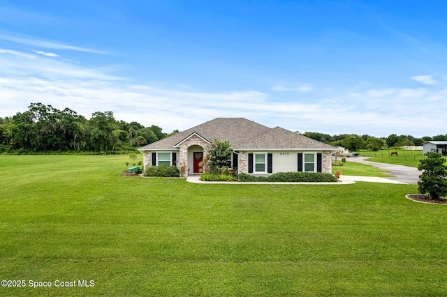6435 Dixie Way, Mims, FL 32754 - ranch-style home featuring a front lawn