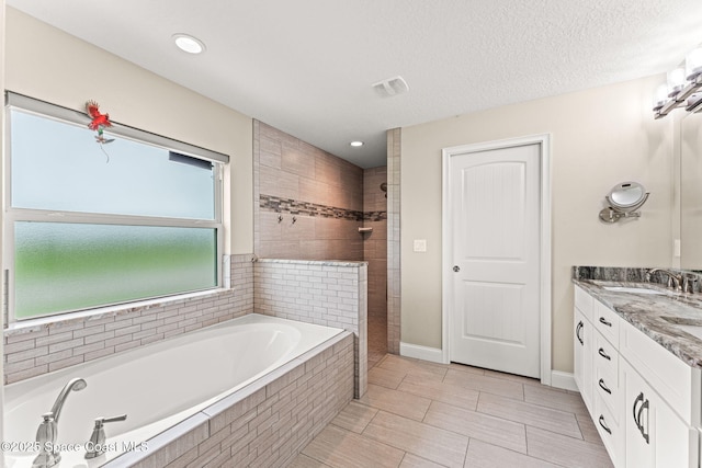 6435 Dixie Way, Mims, FL 32754 - full bath featuring a garden tub, double vanity, a tile shower, recessed lighting, and tile patterned floors