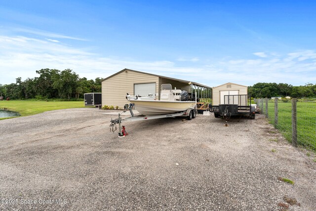 6435 Dixie Way, Mims, FL 32754 - garage with a storage unit and a detached garage
