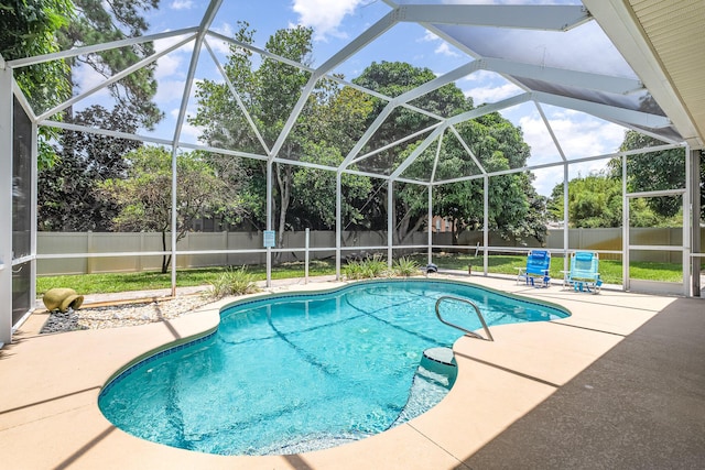 2230 S Courtenay Pkwy, Merritt Island, FL 32952 - view of swimming pool with a fenced backyard, a patio, and a lanai