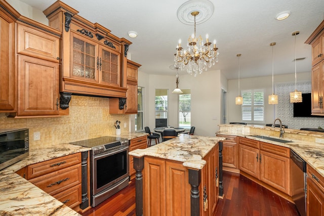 2230 S Courtenay Pkwy, Merritt Island, FL 32952 - kitchen featuring stainless steel appliances, a sink, dark wood-type flooring, light stone countertops, and recessed lighting