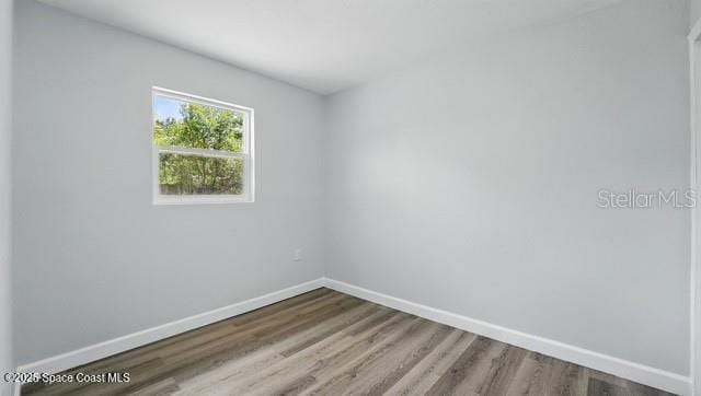 4415 Shaw Ave, Titusville, FL 32780 - unfurnished room with baseboards and wood finished floors