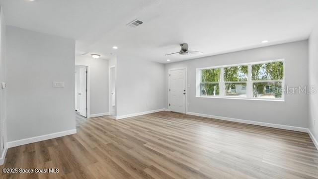 4415 Shaw Ave, Titusville, FL 32780 - empty room with ceiling fan, wood finished floors, baseboards, and recessed lighting