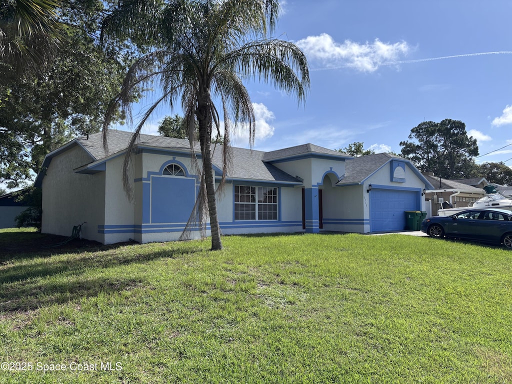 6368 Brandt St, Cocoa, FL 32927 - ranch-style house with a garage, stucco siding, a front lawn, and a shingled roof