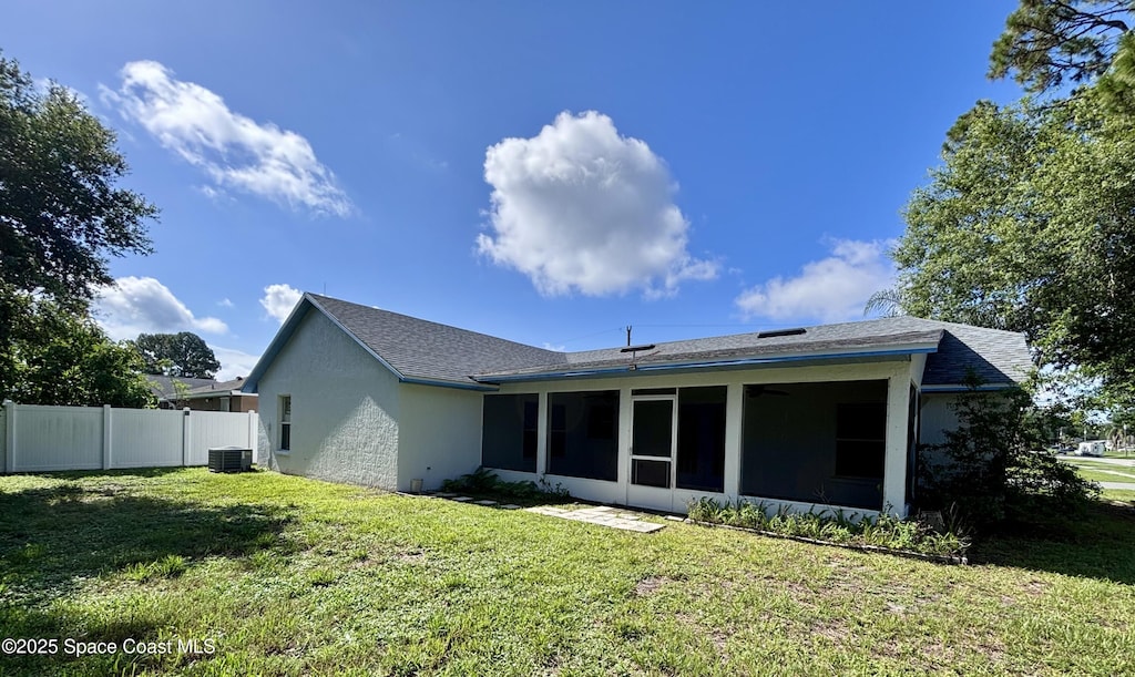 6368 Brandt St, Cocoa, FL 32927 - back of house with a sunroom, stucco siding, and a shingled roof