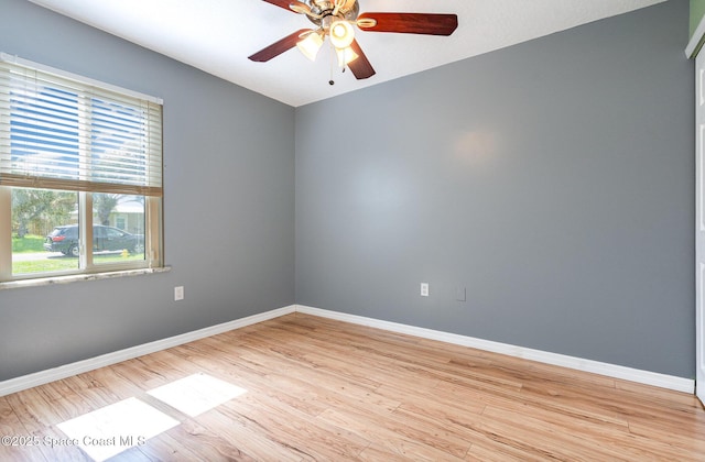 490 Candlestick Ave NE, Palm Bay, FL 32907 - unfurnished room featuring healthy amount of natural light, baseboards, a ceiling fan, and light wood-style floors