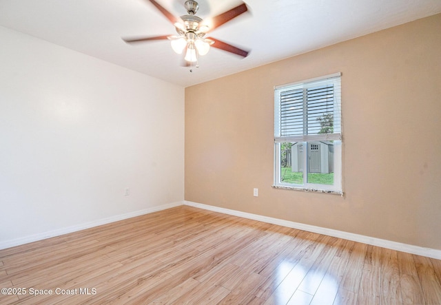 490 Candlestick Ave NE, Palm Bay, FL 32907 - spare room featuring light wood-style floors, baseboards, and a ceiling fan
