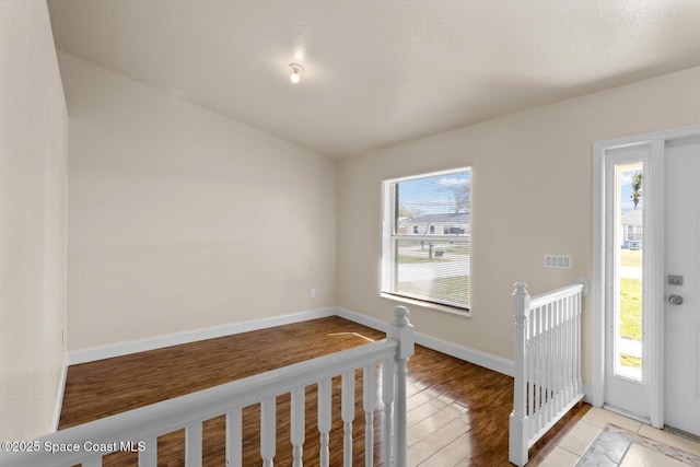 2829 SE Cabana Ln, Port St Lucie, FL 34952 - entrance foyer with healthy amount of natural light, light wood-type flooring, and baseboards