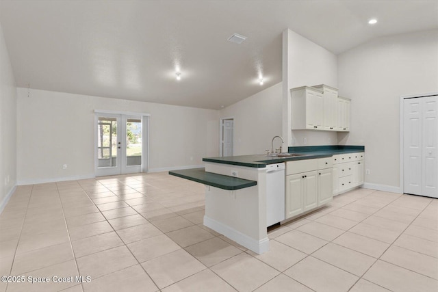 2829 SE Cabana Ln, Port St Lucie, FL 34952 - kitchen with dishwasher, dark countertops, a sink, french doors, and light tile patterned floors