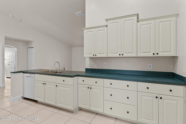 2829 SE Cabana Ln, Port St Lucie, FL 34952 - kitchen with a sink, white dishwasher, dark countertops, a peninsula, and arched walkways