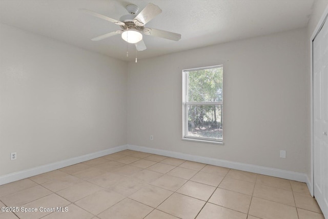 2829 SE Cabana Ln, Port St Lucie, FL 34952 - spare room featuring light tile patterned floors, baseboards, and a ceiling fan