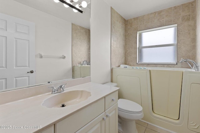 2829 SE Cabana Ln, Port St Lucie, FL 34952 - full bathroom with a bath, tile patterned floors, toilet, and vanity