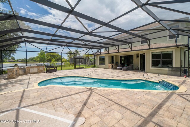 7914 Creshire Ct, Melbourne, FL 32940 - outdoor pool featuring exterior kitchen, a patio area, and glass enclosure