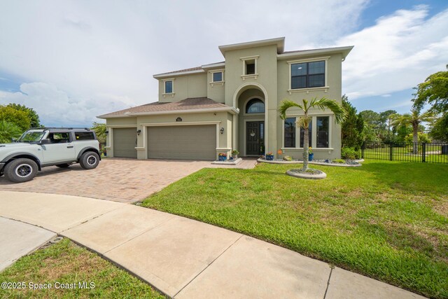 7914 Creshire Ct, Melbourne, FL 32940 - mediterranean / spanish house with stucco siding, decorative driveway, and a garage