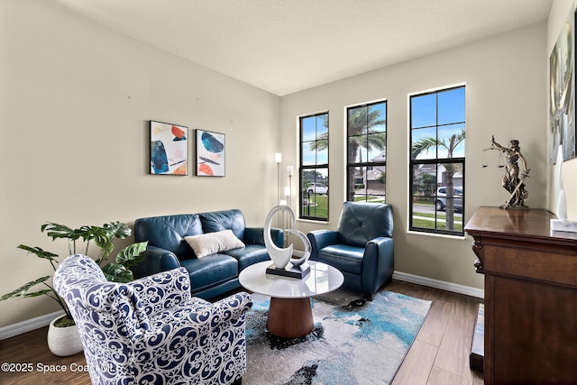 7914 Creshire Ct, Melbourne, FL 32940 - living room featuring baseboards and wood finished floors