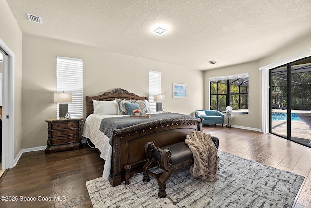 7914 Creshire Ct, Melbourne, FL 32940 - bedroom with access to outside, wood finished floors, baseboards, and a textured ceiling