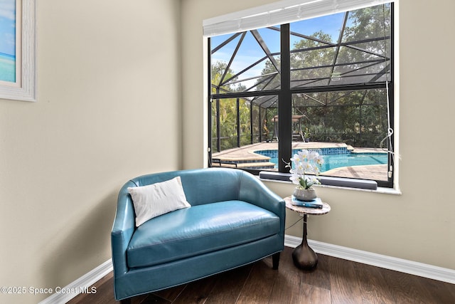 7914 Creshire Ct, Melbourne, FL 32940 - sitting room with a sunroom, baseboards, and wood finished floors