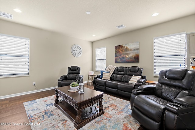 7914 Creshire Ct, Melbourne, FL 32940 - living area featuring wood finished floors, baseboards, and recessed lighting