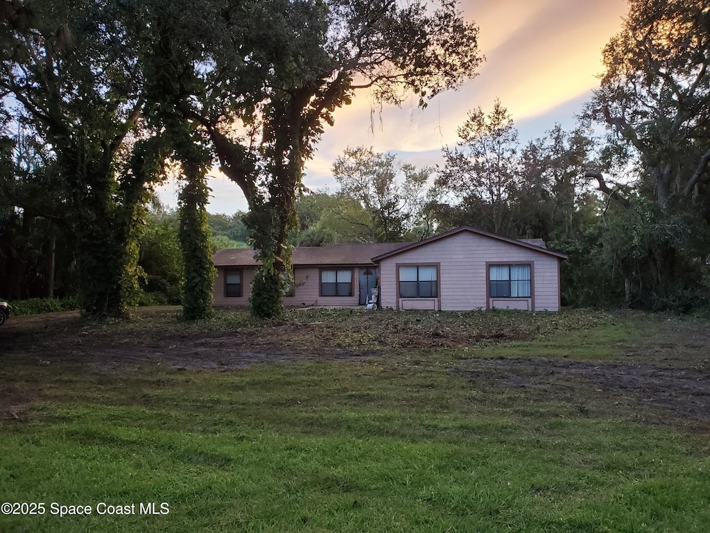 4335 Tangelo Ave, Cocoa, FL 32926 - ranch-style house with a front lawn