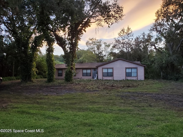 4335 Tangelo Ave, Cocoa, FL 32926 - ranch-style house with a front lawn