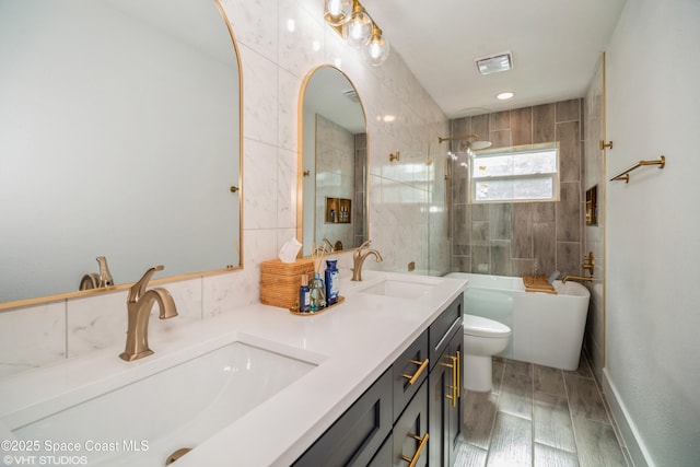 201 NE 3rd St, Satellite Beach, FL 32937 - full bathroom with toilet, wood finished floors, and double vanity