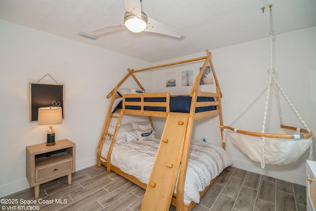 201 NE 3rd St, Satellite Beach, FL 32937 - bedroom featuring wood finish floors, baseboards, and ceiling fan